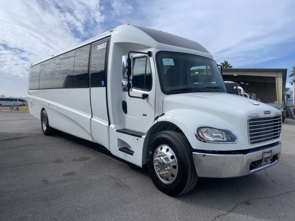 exterior view of a white las vegas mini coach rental