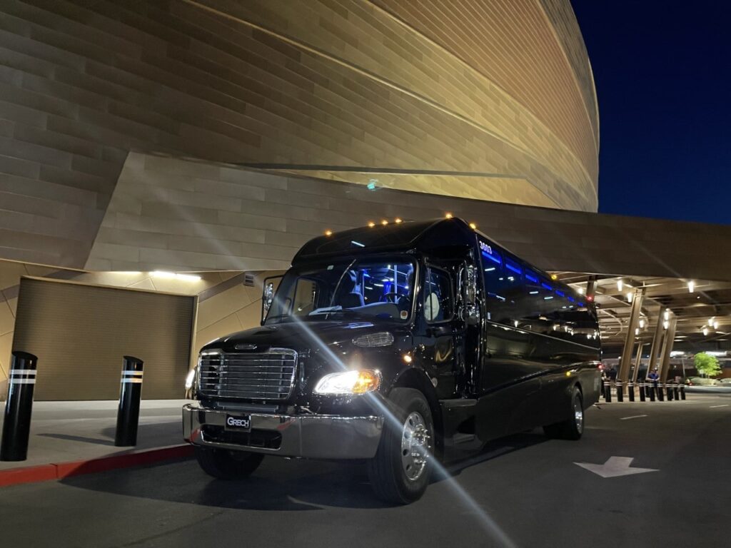 exterior shot of a black mini coach rental in front of a Las Vegas hotel