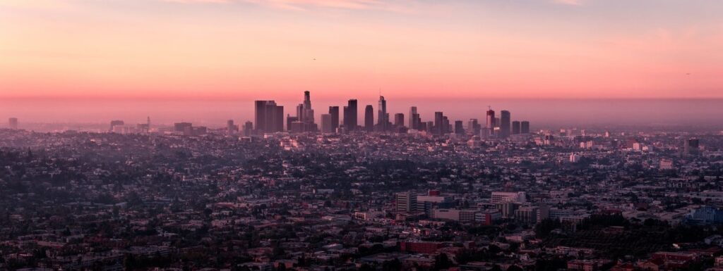 colorful sunset behind the Los Angeles skyline